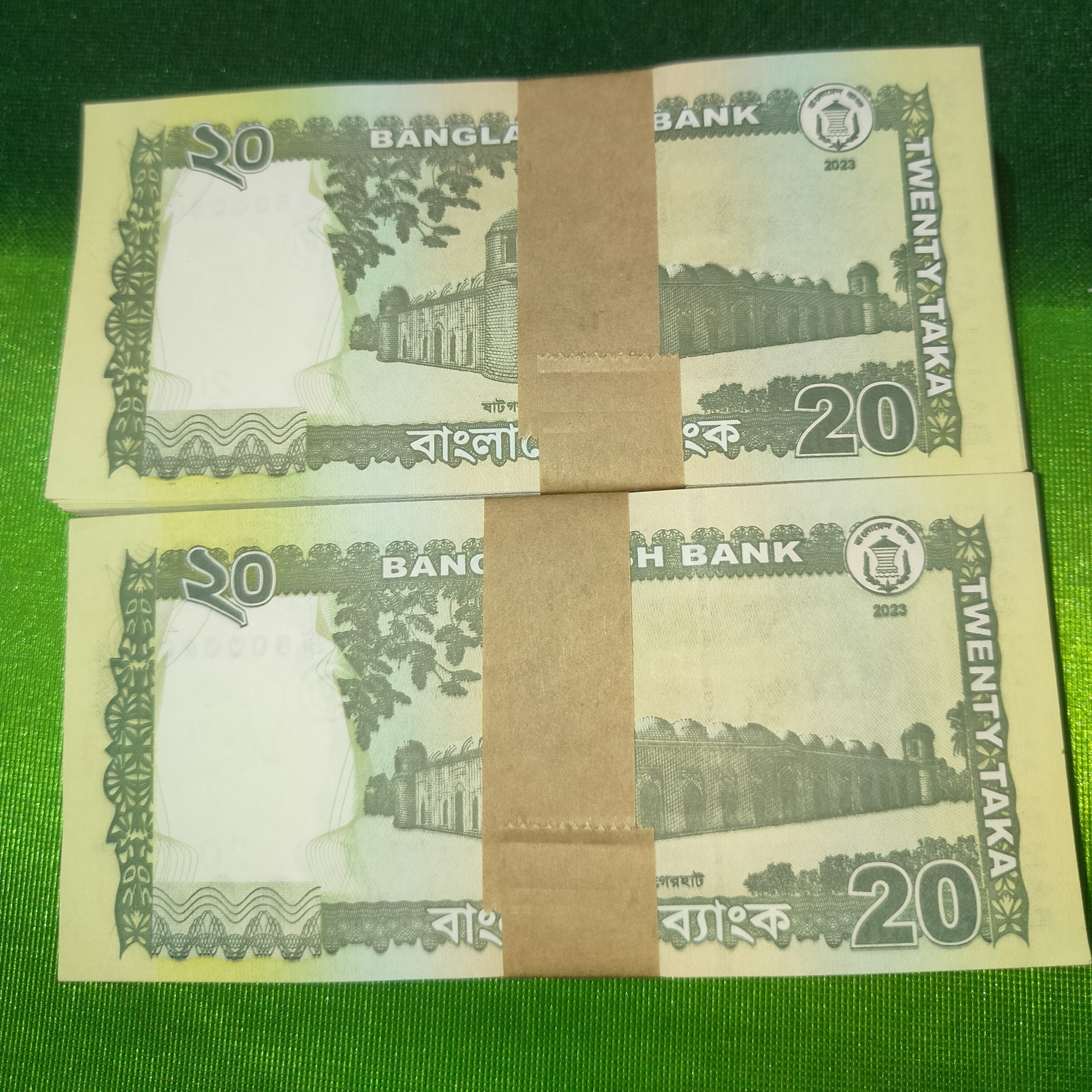 Back view of two new Bangladesh Bank 20 Taka note bundles featuring Kantajew Temple design.